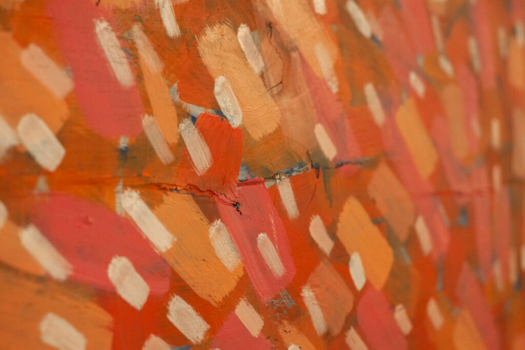 Abstract landscape painting detail showing a dense layer of orange and pink paint strokes under green accents, by Osmar