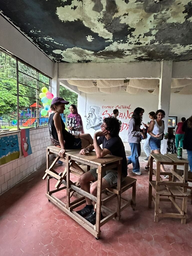 Candid photo of a group of students or designers collaborating during an indoor workshop, conducted by Osmar