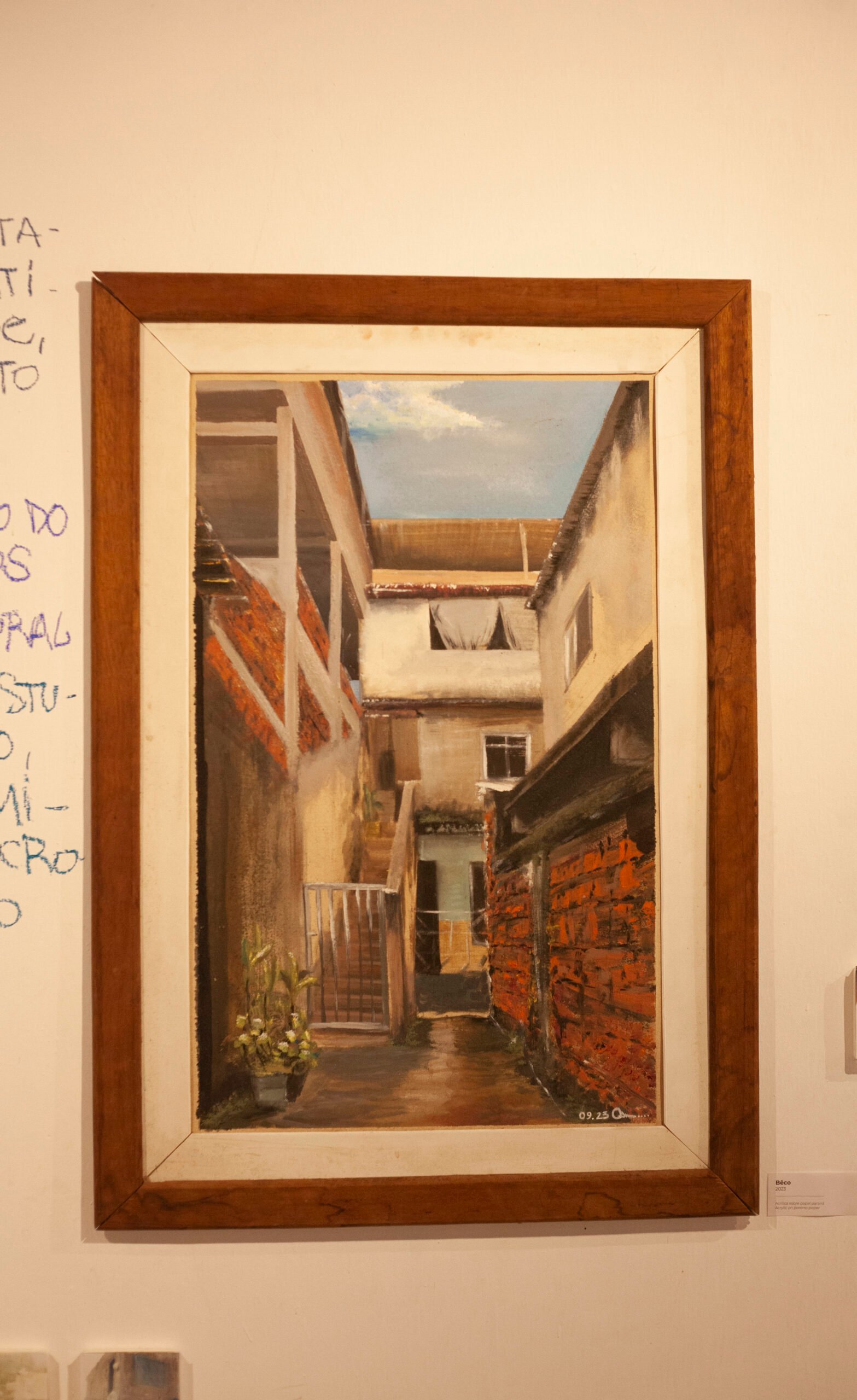 Framed painting hanging on a wall, showing an internal perspective of a historic courtyard, by Osmar