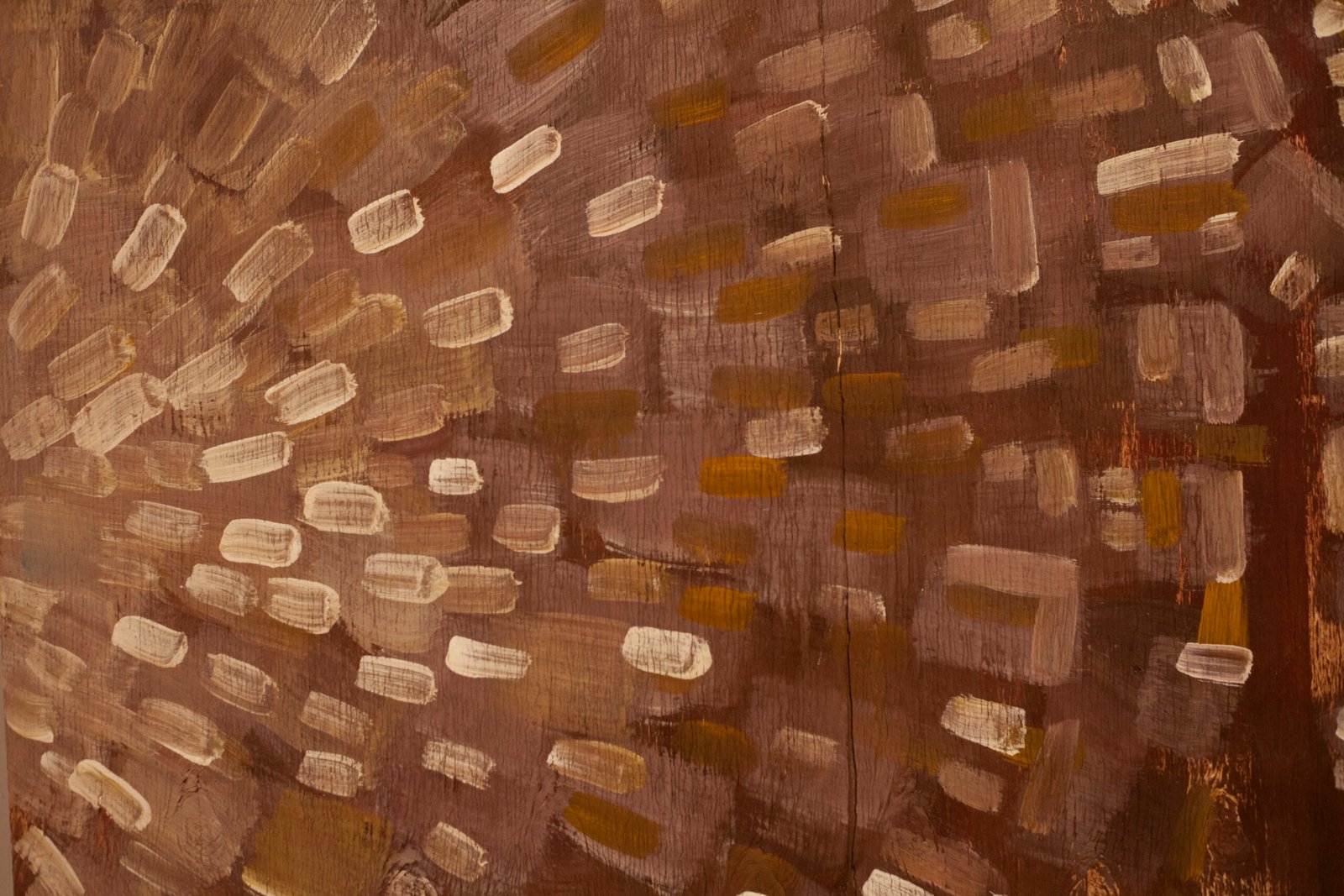 Textured brown artwork surface showing subtle patterns of horizontal light beige dashes, by Osmar